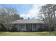 Ranch style home with front porch and mature trees at 1821 Stanley St, Longwood, FL 32750