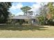 Ranch-style home with spacious backyard and mature landscaping at 1821 Stanley St, Longwood, FL 32750