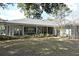 Back view of the house showcasing a large covered patio at 1821 Stanley St, Longwood, FL 32750