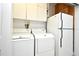 Laundry room with washer, dryer, refrigerator and storage cabinets at 1821 Stanley St, Longwood, FL 32750