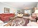 Living area with formal dining area and ornate rug at 1821 Stanley St, Longwood, FL 32750