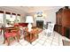 Inviting living room featuring a fireplace, windows with red blinds, and neutral wall colors at 1821 Stanley St, Longwood, FL 32750