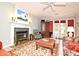 The living room features a cozy fireplace, ceiling fan, and access to the outdoors at 1821 Stanley St, Longwood, FL 32750