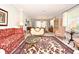 Elegant living room with ornate furniture and a large area rug at 1821 Stanley St, Longwood, FL 32750