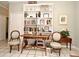 Charming study with built-in shelving and antique wooden chairs at 1821 Stanley St, Longwood, FL 32750