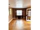 Bright living room featuring hardwood floors and a large window at 206 Tangerine Pl, Maitland, FL 32751