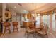 Kitchen features light wood cabinets and a breakfast nook with bay windows at 2104 Cranberry Isles Way, Apopka, FL 32712