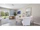 Modern dining area with round table and white chairs, near sliding glass doors at 2175 Longleaf Rd, Davenport, FL 33837