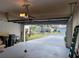 Attached garage with overhead storage and door opener at 2310 Grasmere Cir, Clermont, FL 34711