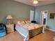 Spacious main bedroom with large bed and attached bathroom at 2310 Grasmere Cir, Clermont, FL 34711