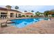 Relaxing resort-style pool with adjacent clubhouse at 2310 Grasmere Cir, Clermont, FL 34711