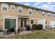 Backyard with a small patio area, and ample green space at 2583 Sedge Grass Way, Orlando, FL 32824