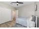 This bedroom features a ceiling fan, closet, and plush rug at 2583 Sedge Grass Way, Orlando, FL 32824