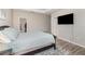 The bedroom features a large bed, walk-in closet, and mounted TV at 2583 Sedge Grass Way, Orlando, FL 32824