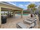 Community pool area with lounge chairs and shaded seating at 2583 Sedge Grass Way, Orlando, FL 32824