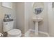 Small powder room with pedestal sink and updated fixtures at 2583 Sedge Grass Way, Orlando, FL 32824