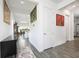 Bright and airy entryway with grey wood-look tile floors and views into the living area at 2709 Greenlands St, St Cloud, FL 34772