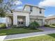 Two-story house with a two-car garage and palm trees at 2709 Greenlands St, St Cloud, FL 34772