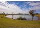 Tranquil lake view with lush greenery and birds at 2709 Greenlands St, St Cloud, FL 34772