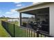 Screened patio overlooking a lake with outdoor furniture at 2709 Greenlands St, St Cloud, FL 34772