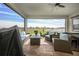 Relaxing screened porch with patio furniture and lake view at 2709 Greenlands St, St Cloud, FL 34772