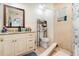 Bathroom featuring a tiled shower and granite countertop at 2825 Greenfield Ave, Orlando, FL 32808