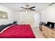 Bedroom featuring neutral tile flooring and a ceiling fan at 2825 Greenfield Ave, Orlando, FL 32808