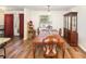 Traditional dining room boasts classic wood furniture and natural light from a window at 2825 Greenfield Ave, Orlando, FL 32808