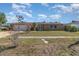 Charming brick home featuring a two-car garage and neatly manicured front lawn at 2825 Greenfield Ave, Orlando, FL 32808