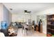 A bright, naturally lit living area featuring tile flooring, a ceiling fan and neutral paint at 2825 Greenfield Ave, Orlando, FL 32808