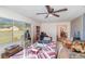 A cozy seating area beside an adjacent dining area offering tile floors and bright lighting at 2825 Greenfield Ave, Orlando, FL 32808