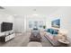 Living room with beige sofa, rug, and media console at 3092 Water Sprite St, Orlando, FL 32808