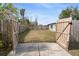 Large backyard with wooden fence and gated entry at 3118 Clemwood St, Orlando, FL 32803