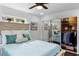 Bedroom featuring a light wood bed frame, dark hardwood floors, and mirrored closet doors at 3118 Clemwood St, Orlando, FL 32803