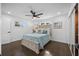 Bright bedroom with a light wood bed frame, dark hardwood floors and large closet at 3118 Clemwood St, Orlando, FL 32803