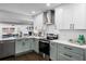 Newly renovated kitchen featuring stainless steel appliances and stylish light green cabinets at 3118 Clemwood St, Orlando, FL 32803