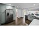 Modern kitchen with light green cabinets, stainless steel appliances, and quartz countertops at 3118 Clemwood St, Orlando, FL 32803