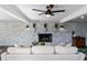 Living room with a whitewashed brick fireplace and hardwood floors at 3118 Clemwood St, Orlando, FL 32803