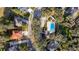 Stunning aerial view of a neighborhood featuring a private pool and lush landscaping at 3442 Starbird Dr, Ocoee, FL 34761