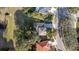 Birds-eye view of a neighborhood with lush green lawns and mature trees at 3442 Starbird Dr, Ocoee, FL 34761