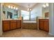 Bathroom with double vanity, corner tub, and tile flooring at 3442 Starbird Dr, Ocoee, FL 34761