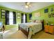 Guest bedroom with a double bed and green walls at 3442 Starbird Dr, Ocoee, FL 34761