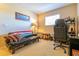 Bedroom with comfortable seating, desk area, and natural light at 3442 Starbird Dr, Ocoee, FL 34761