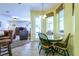 Breakfast nook features cozy seating, bright windows, and view into the living room at 3442 Starbird Dr, Ocoee, FL 34761