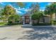Community clubhouse features manicured landscaping and inviting double-door entrance at 3442 Starbird Dr, Ocoee, FL 34761