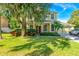 House exterior showcasing a two-story home with lush landscaping at 3442 Starbird Dr, Ocoee, FL 34761