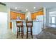 Open kitchen area with barstool seating and stainless-steel appliances at 3442 Starbird Dr, Ocoee, FL 34761
