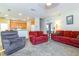 Cozy living room with plush carpet, comfortable seating, and an open floor plan at 3442 Starbird Dr, Ocoee, FL 34761