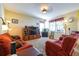 Comfortable living room featuring two sofas, a fish tank and built-in shelving at 3442 Starbird Dr, Ocoee, FL 34761