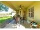 Cozy covered patio with seating area, perfect for outdoor dining at 3442 Starbird Dr, Ocoee, FL 34761